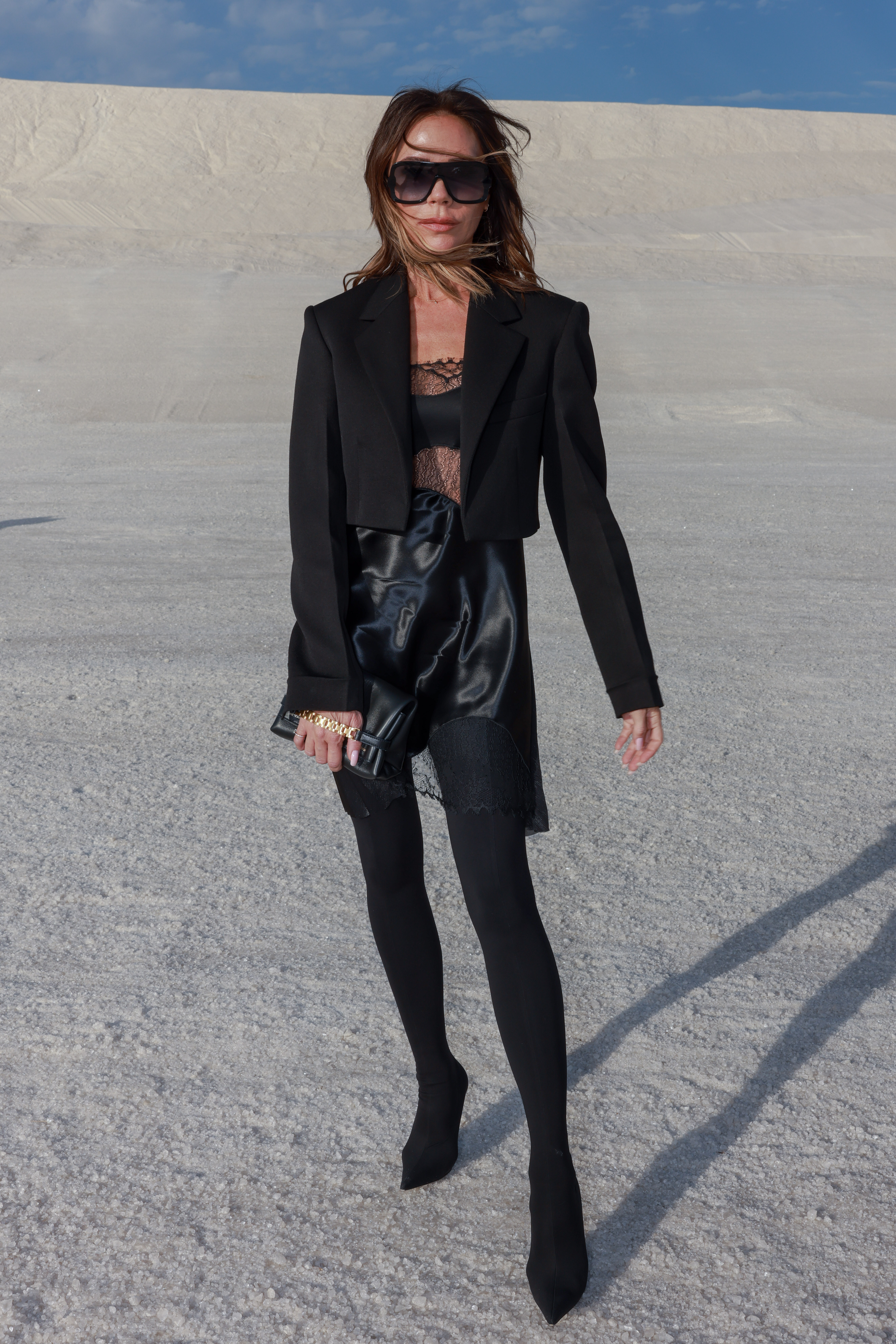 Victoria Beckham style: Victoria Beckham raises some eyebrows wearing black tights in 30-degree heat