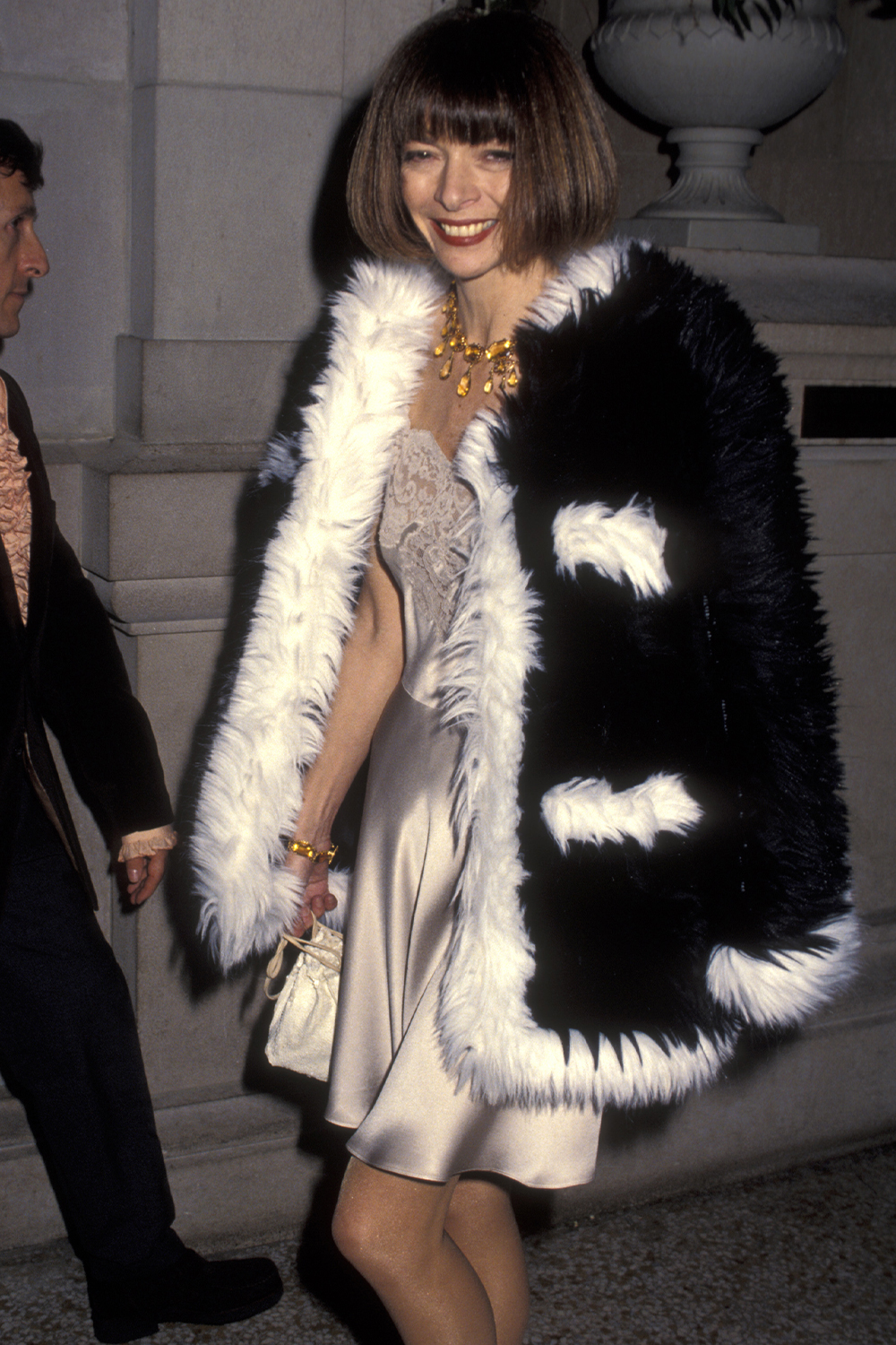 Iconic party looks: Anna Wintour in a furry coat and slip dress