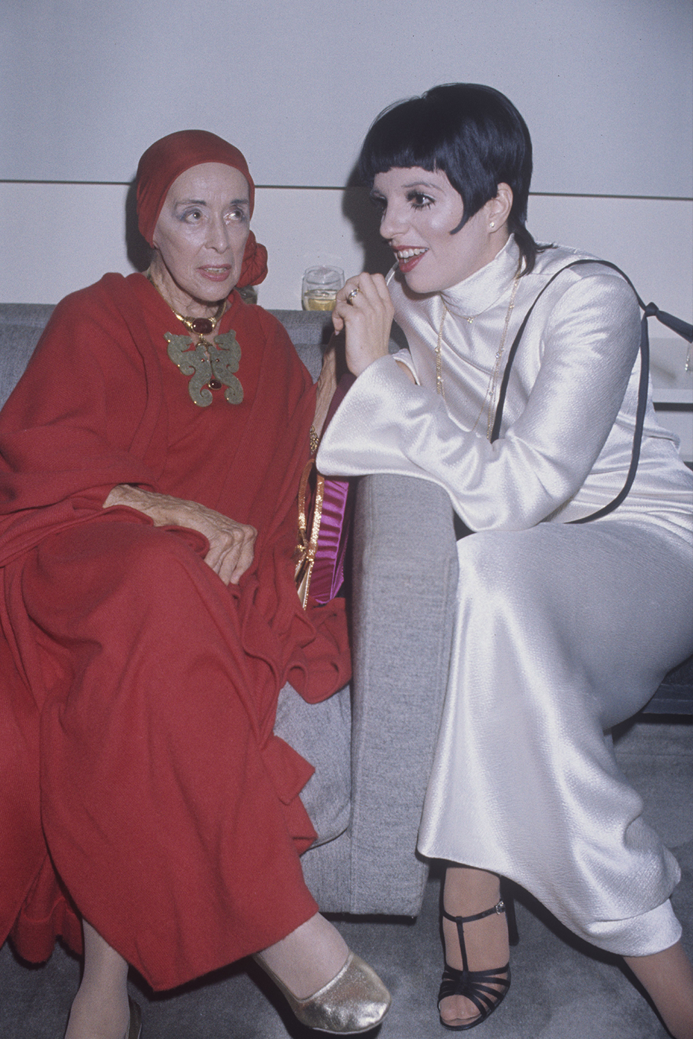 Iconic party outfits: Liza Minnelli in a white satin maxi dress
