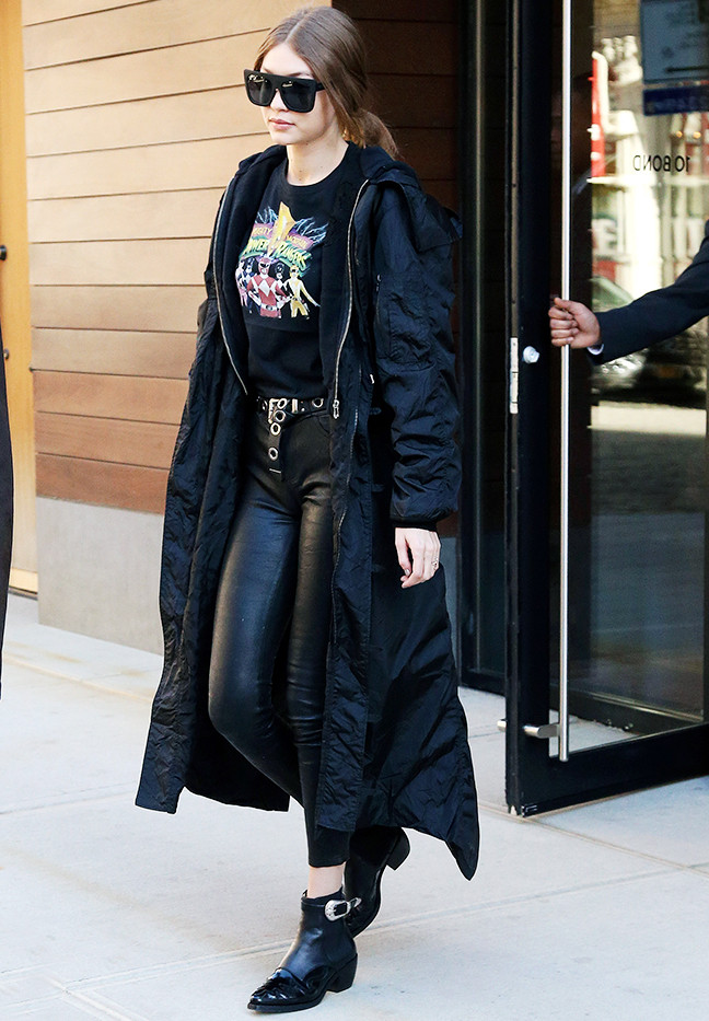Gigi hadid sunglasses: black coat, leather trousers, and Quay sunglasses