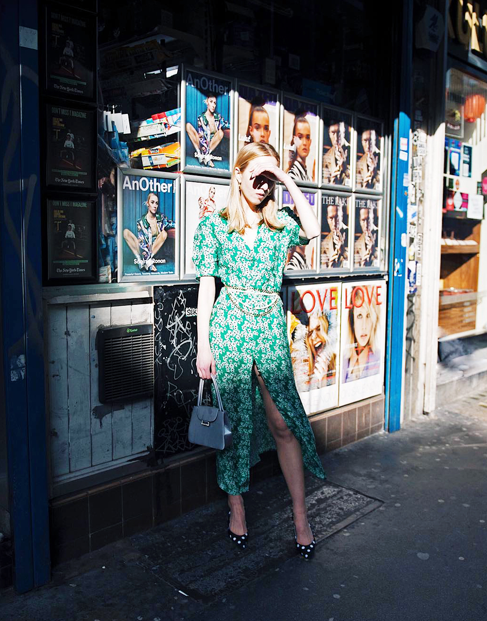 Spring street style outfit ideas 2018: Alice Zielasko wearing a green printed Rixo dress with polka dot pumps