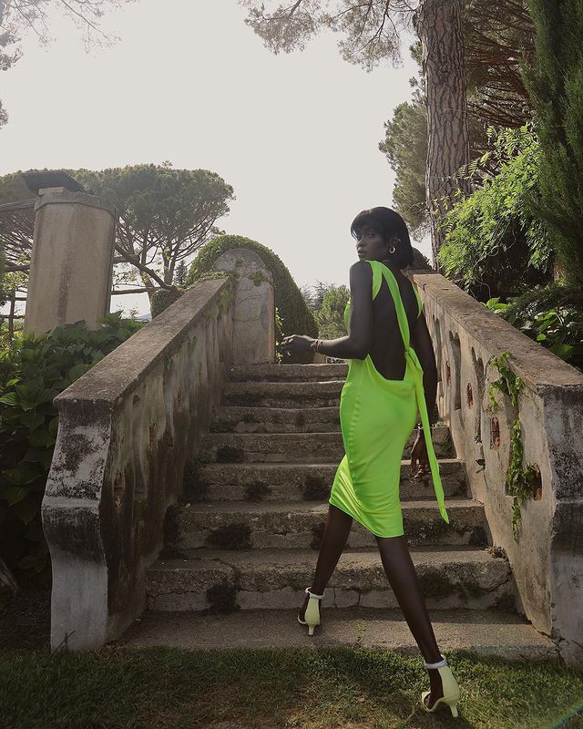 Wedding guest dresses: @lefevrediary wears a green backless dress to a wedding