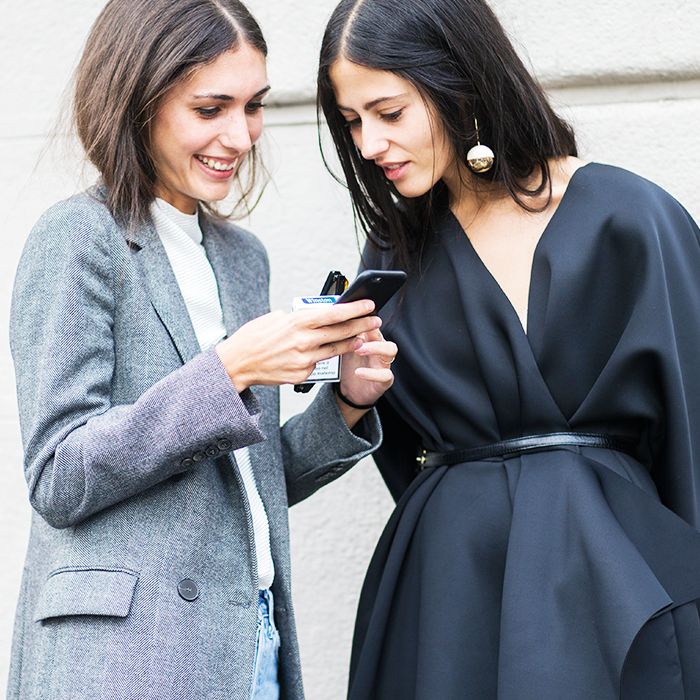 Zara Shape the Invisible: Women looking at a phone