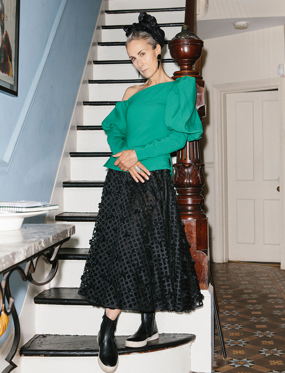 over 50 fashion and clothing inspiration: Caryn Franklin wearing a green puffy-sleeved Osman top with a black skirt and sneakers