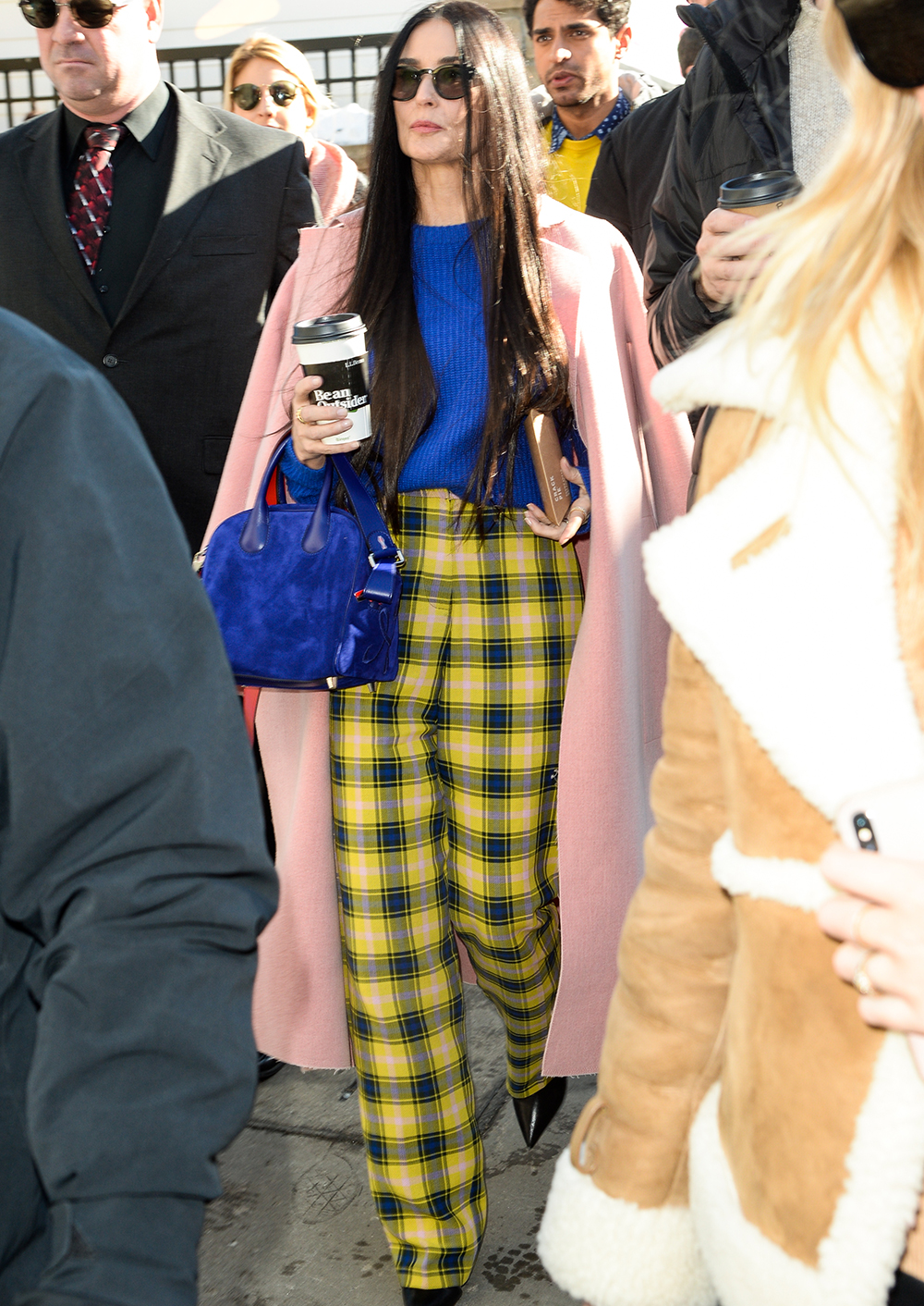 over 50 fashion and clothing inspiration: Demi Moore in yellow checked trousers and a pink coat