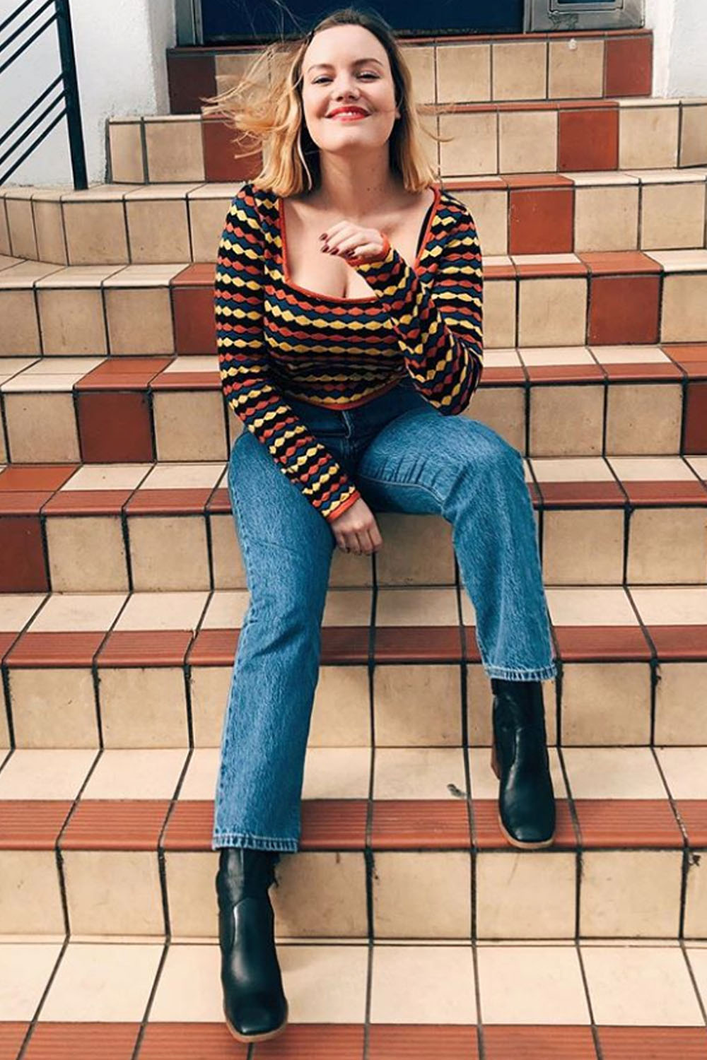 shopping for girls with large busts: ASOS Lotte wearing a striped top
