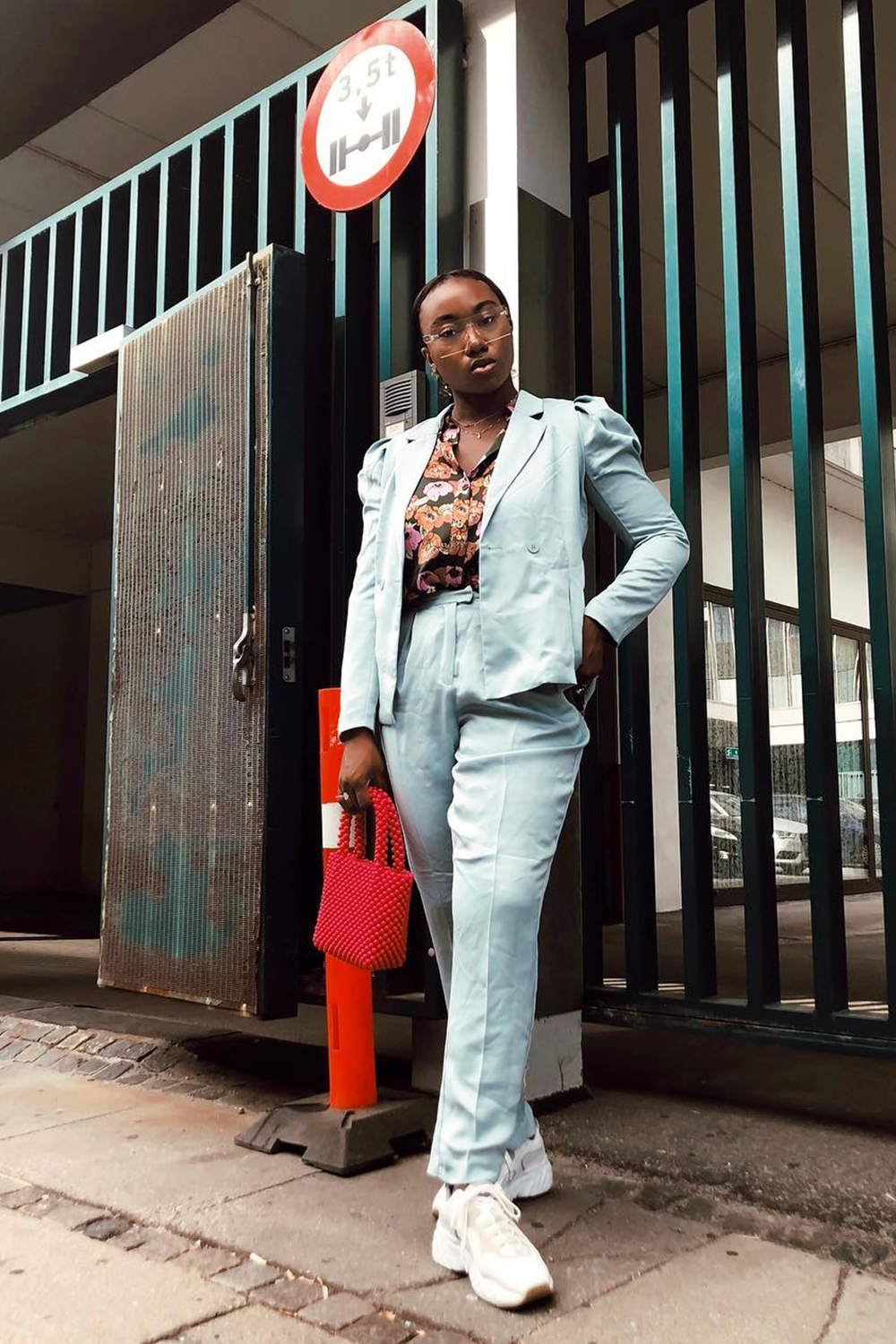 Copenhagen Fashion Week street style: Nnenna Echem wearing a blue suit and Acne trainers