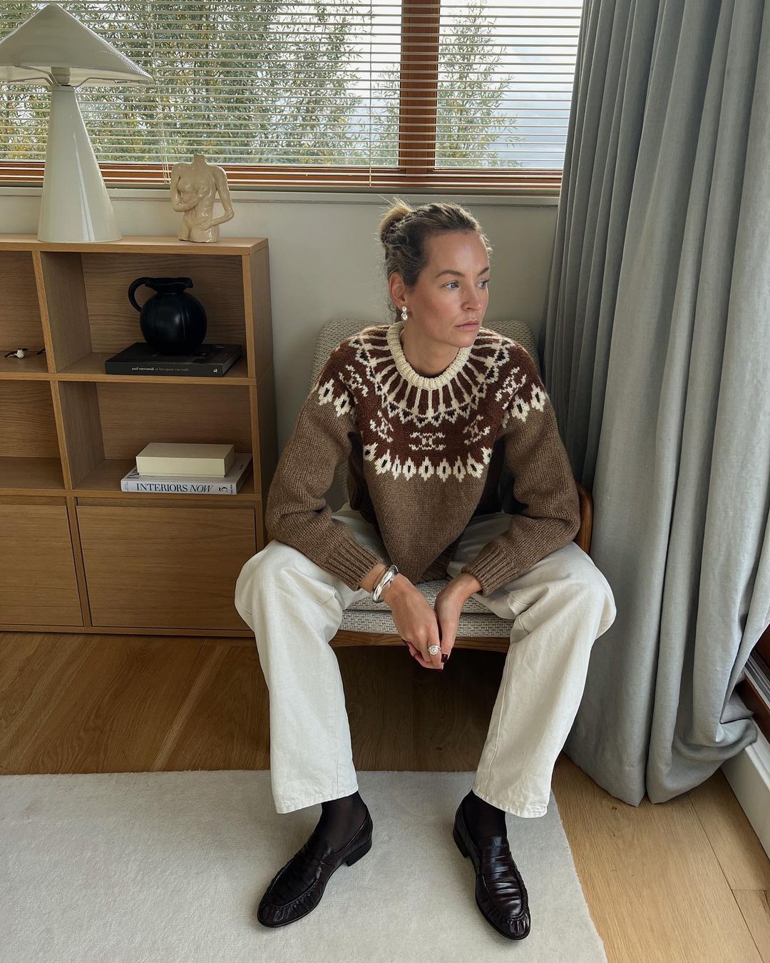 Best fairisle jumpers: @anoukyve wears a brown knit with white jeans