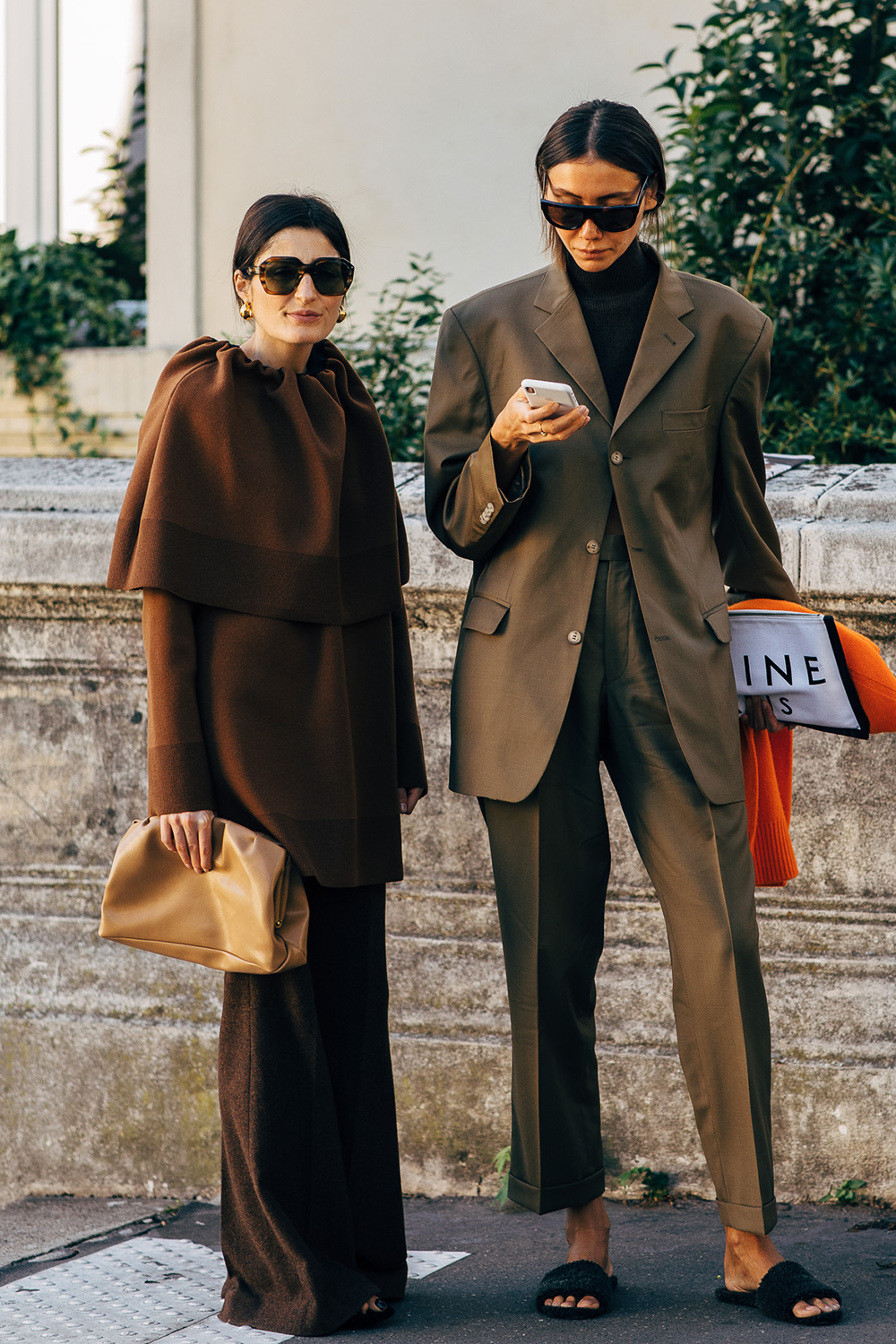 Irina Linovich and Julie Pelias wearing tonal brown Celine outfits