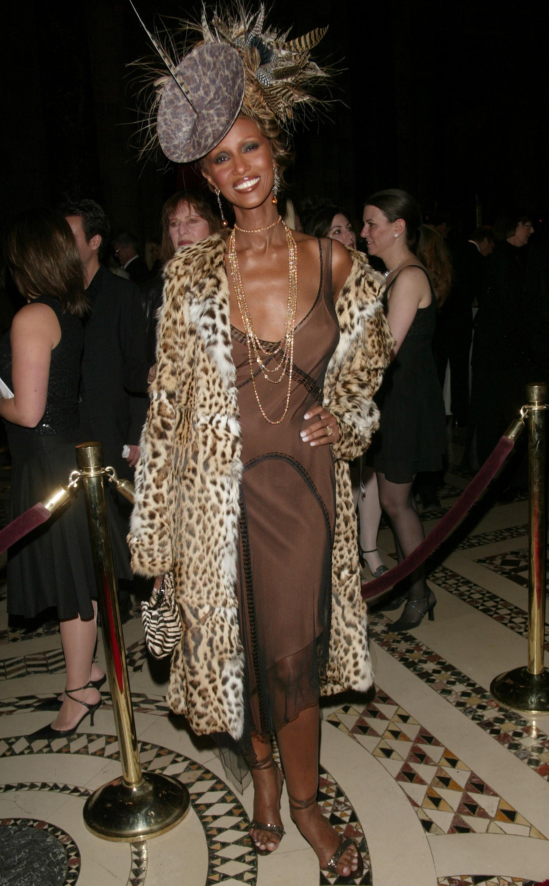 Iconic party looks: Iman wearing a leopard print dress