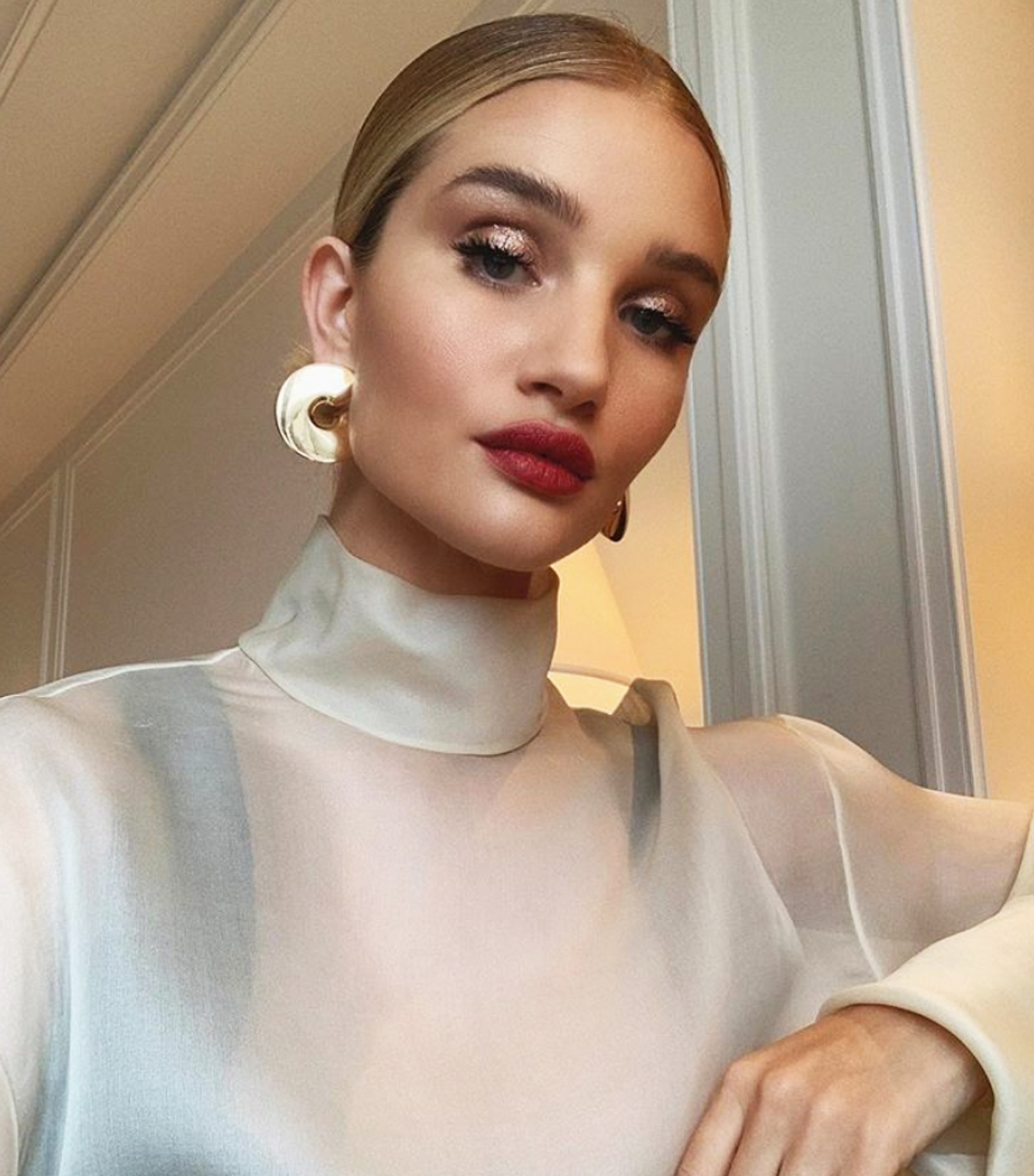 How to dress up an outfit: Rosie Huntington Whiteley with gold earrings
