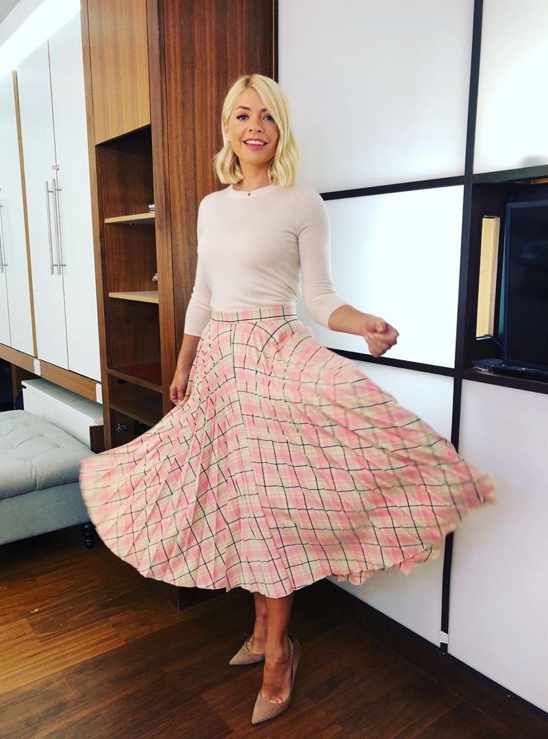 Holly Willoughby Beauty Products: Holly wearing pleated midi skirt and sweater