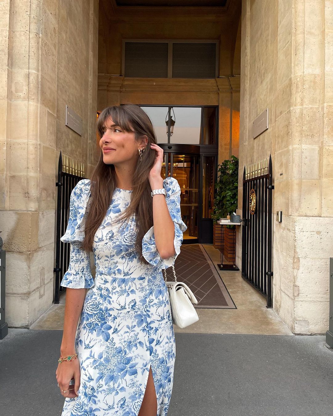 French Girl Wedding Guest Outfits: Julie Sergent Ferreri wears a blue and white printed dress