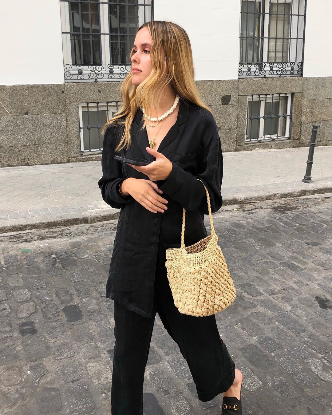 Topshop Beauty: Lucia Cuesta wearing black suit and straw bag