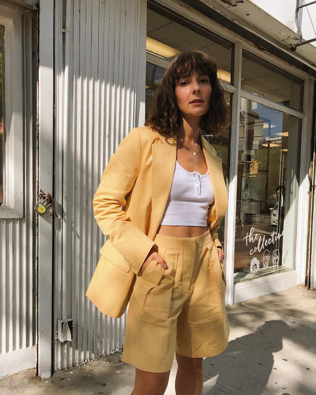 Pineapple Skincare: Alyssa Coscarelli wearing yellow shorts suit