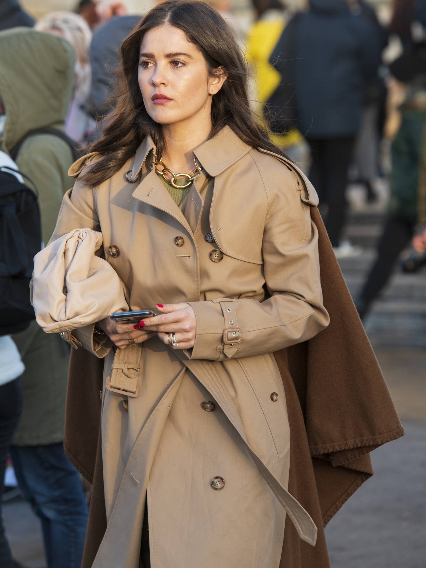 The Best Burberry Trench Coats for Women: Show-goer wears Burberry trench coat.