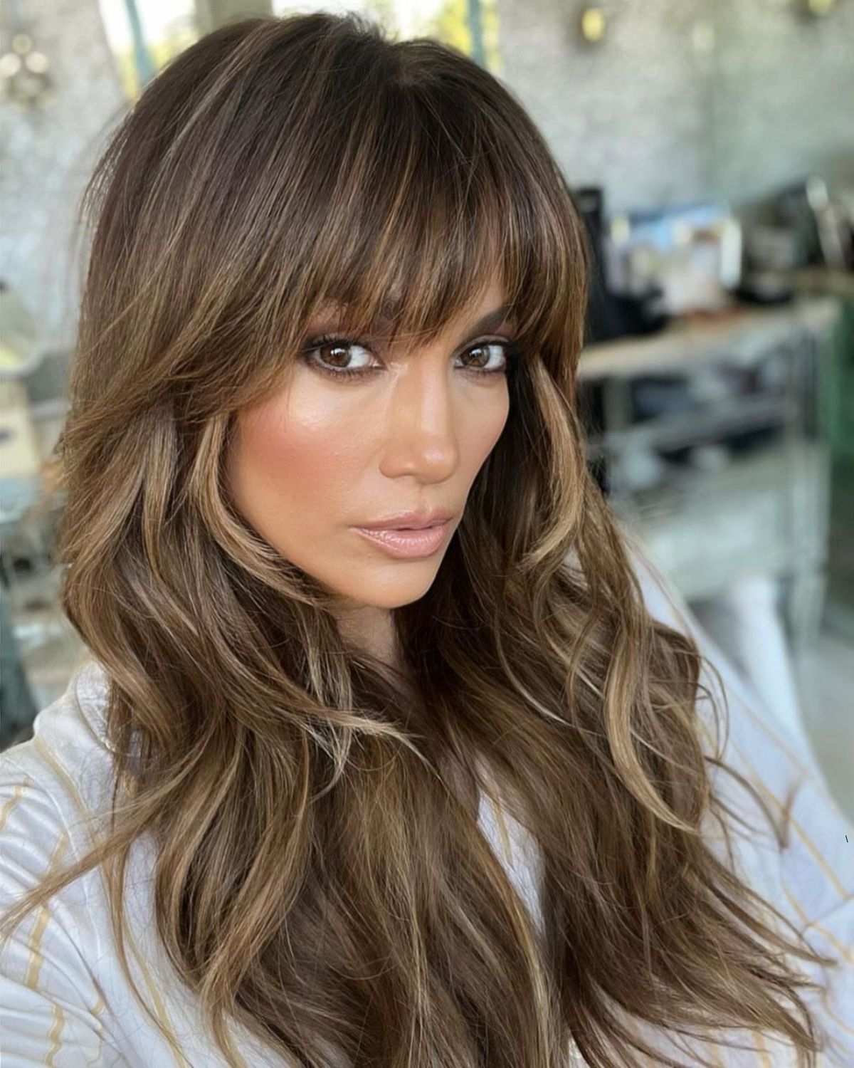 Jennifer Lopez taking a picture with new hair
