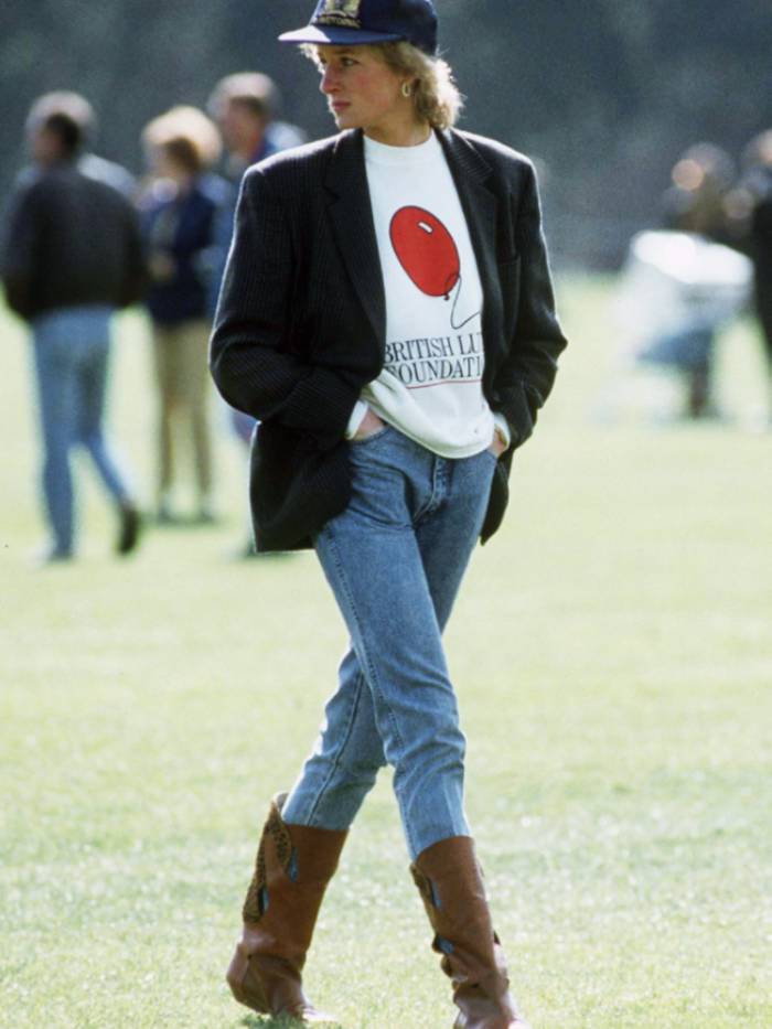 Princess Diana wears oversized blazer, sweatshirt and jeans with boots
