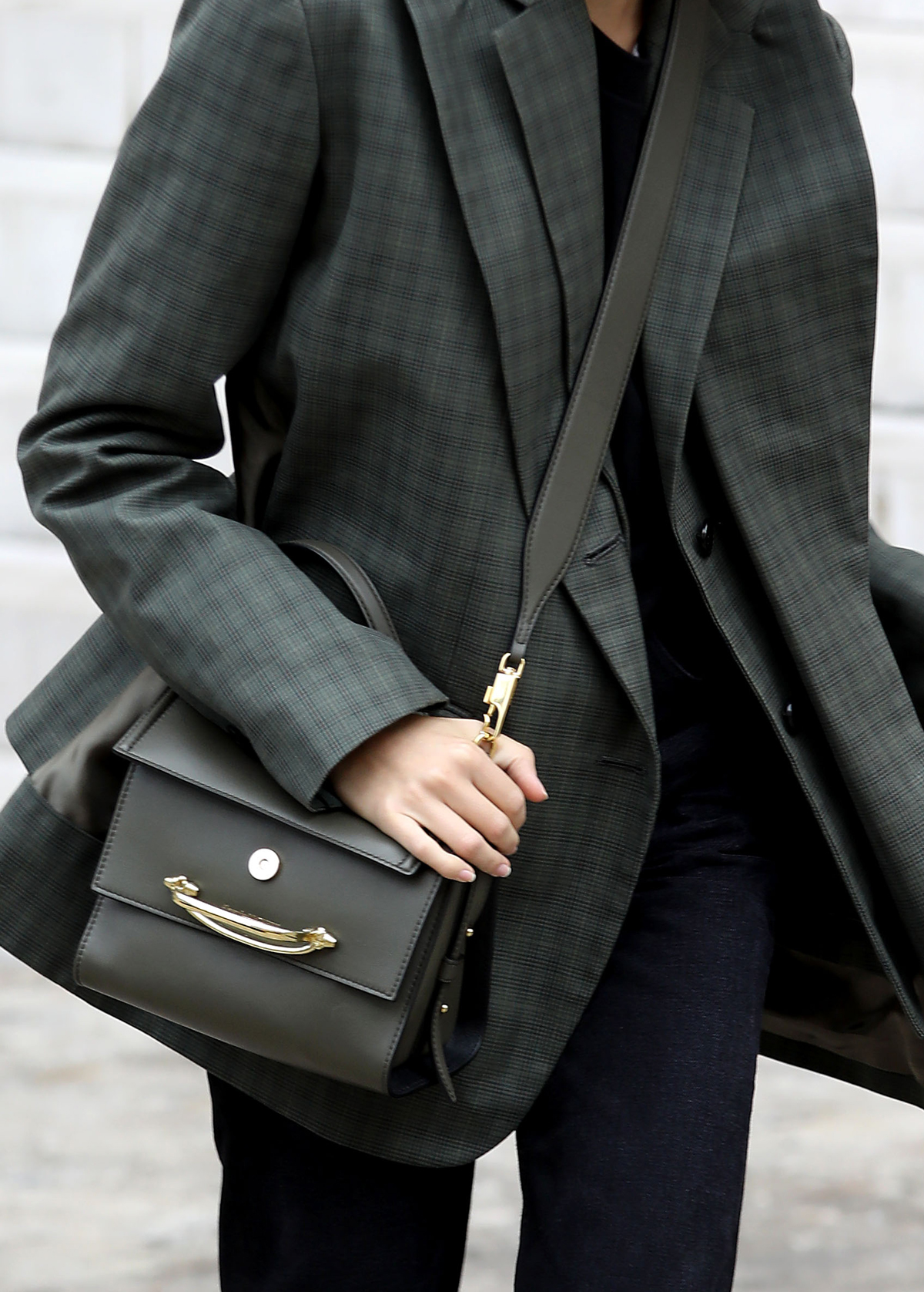 Best designer handbags 2020: Alexander McQueen story bag as seen on model wearing a green checked jacket