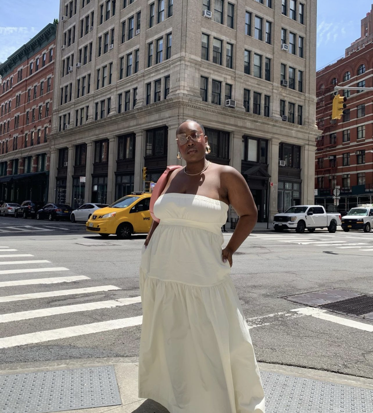 The 28 Best Throw-On Dresses for 2023: @aniyahmorinia wears a cream bandeau dress and pink bag