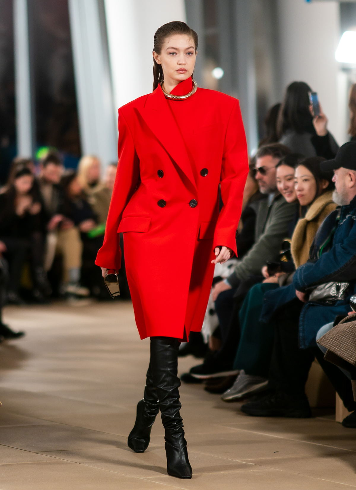Autumn winter 2020 fashion trends: Gigi Hadid on catwalk in red coat and boots