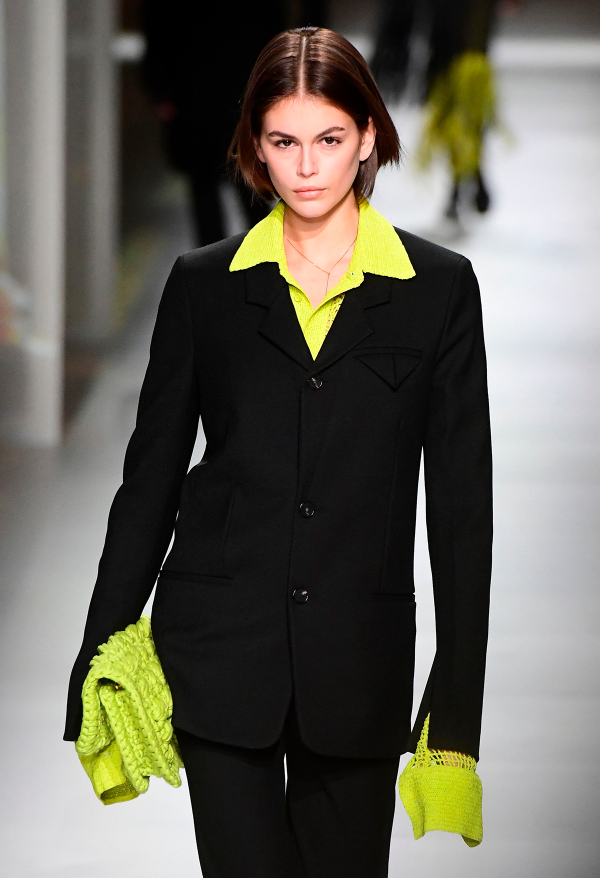 Autumn winter 2020 fashion trends: Kaia Gerber in neon green pointed collar and suit