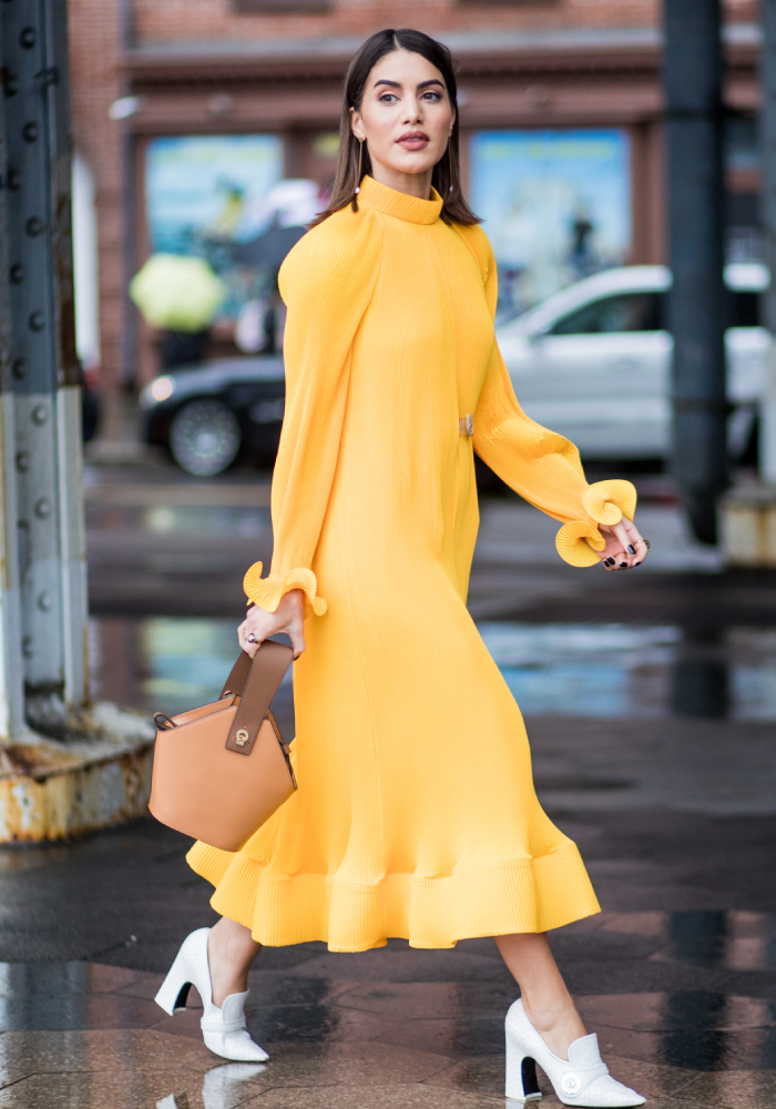 best street style outfits: that yellow tibi dress being worn at new york fashion week