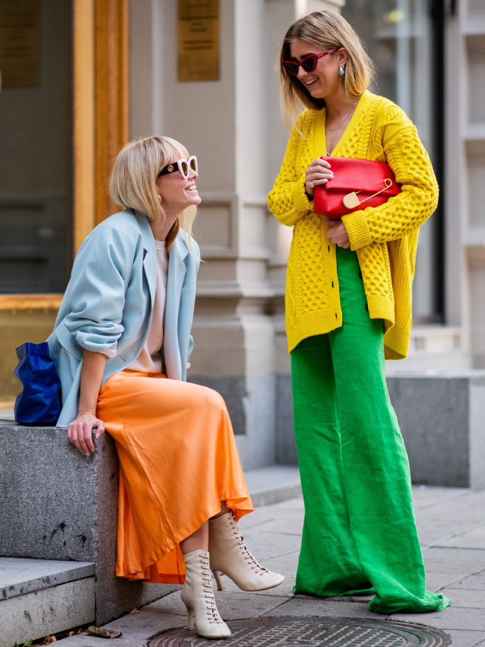 best street style outfits: jeanette madsen and emili sindlev wearing colourful block colours