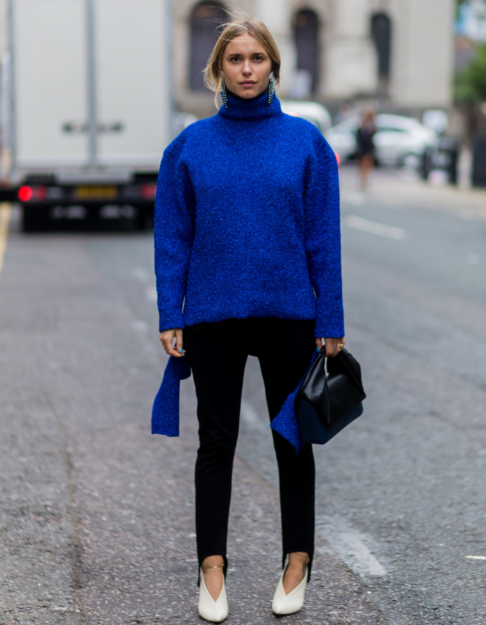 best street style outfits: pernille teisbaek wearing a blue jumper and stirrup leggings