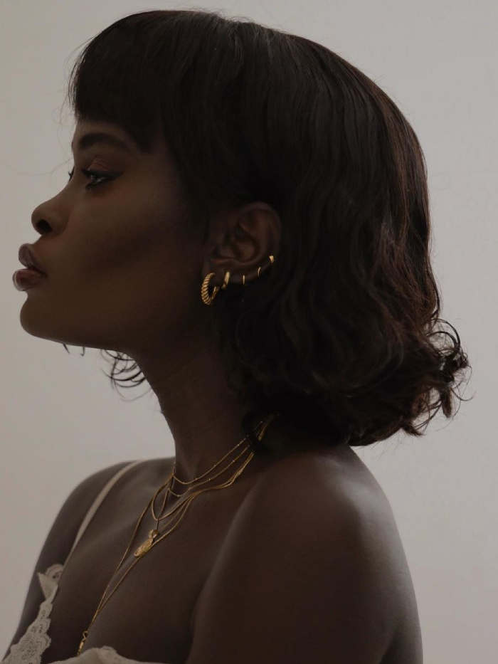 gold jewellery: amy lefevre wearing gold earrings and gold necklaces