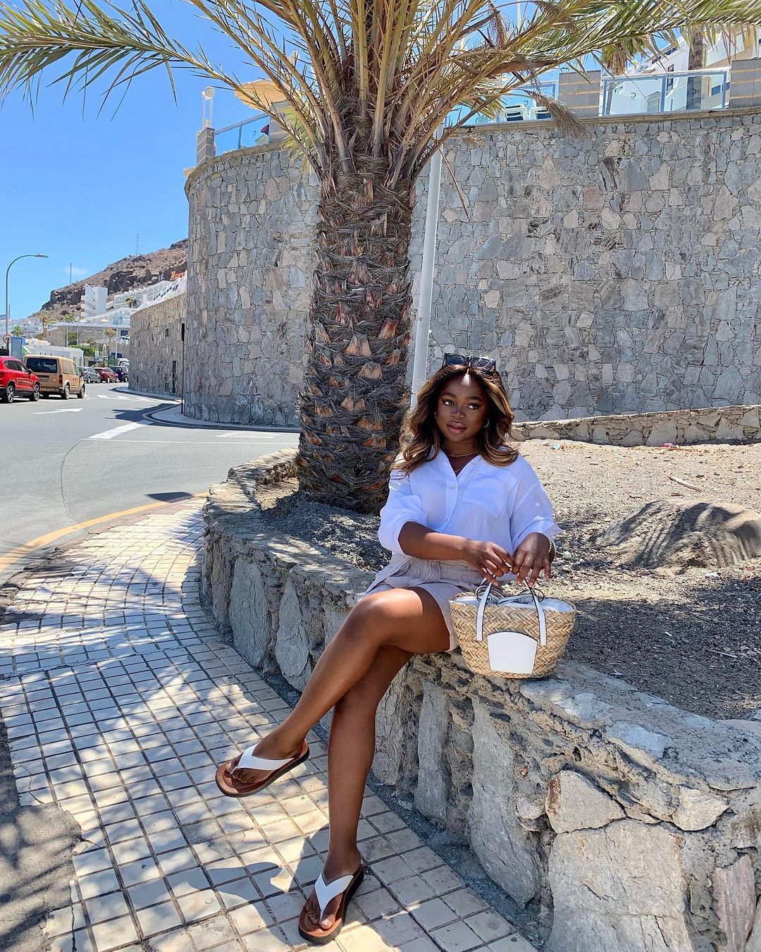 Marks and Spencer summer shoes: @evody.onesi wears a pair of white toe-post sandals from Marks & Spencer