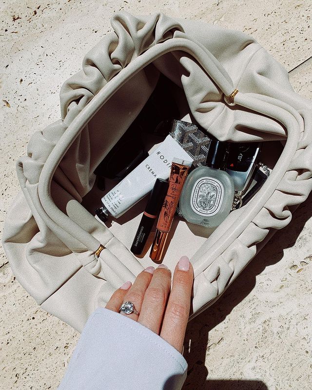 Best French Perfumes: @rosiehw carries a Diptyque perfume in her clutch bag