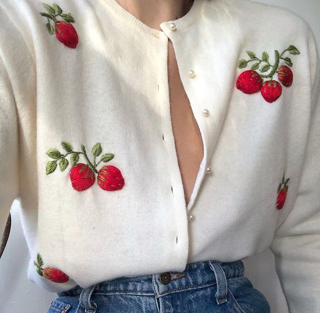 Autumn Knitwear Trends 2021: @luciazolea wears a strawberry embroidered vintage cardigan