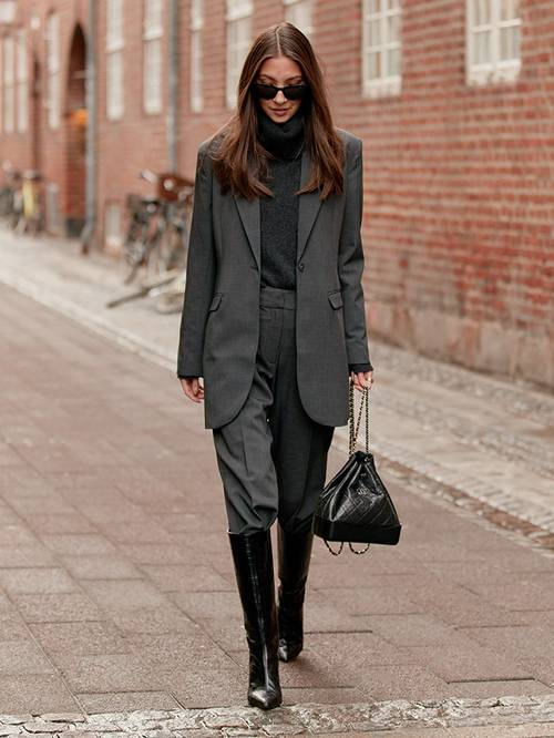 Outfits with Knee-High Boots: @thestylestalkercom captures a show-goer in black knee boots
