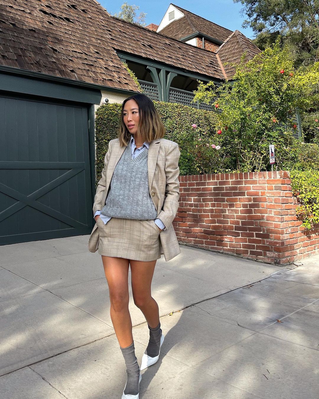 Business casual winter outfits: skirt suit and sweater