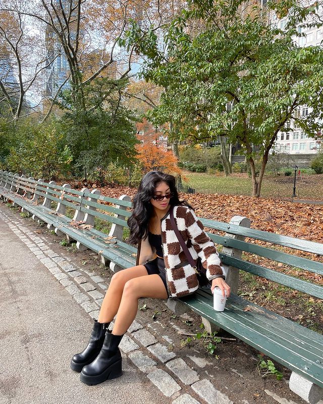 Winter Microtrends: @jeannine.roxas wears a pair of platform boots with a checkerboard cardigan