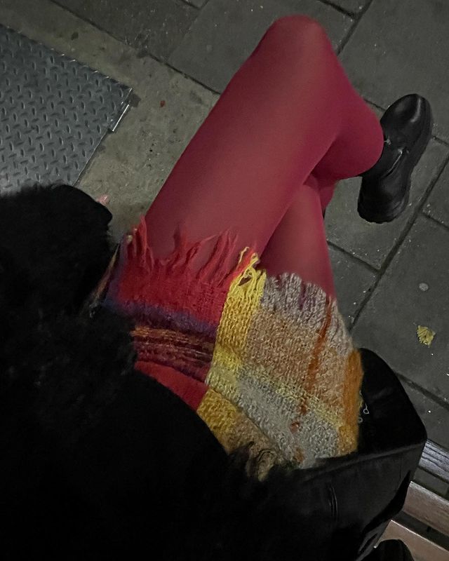 Winter Microtrends: @lucywilliams02 wears red tights with a checked mini skirt