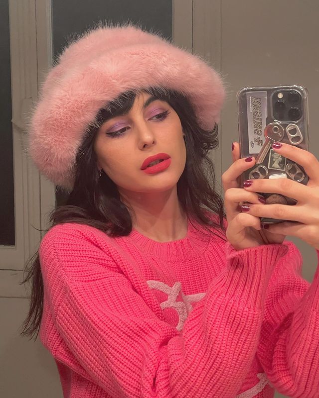 Winter Microtrends: @maria_bernad styles a pink faux fur bucket hat with a bright pink jumper