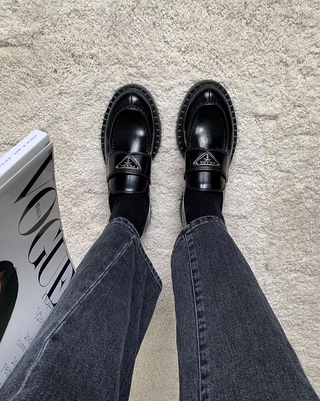 Best Designer Loafers: @symphonyofsilk styles her Prada loafers with black socks and grey straight-leg jeans