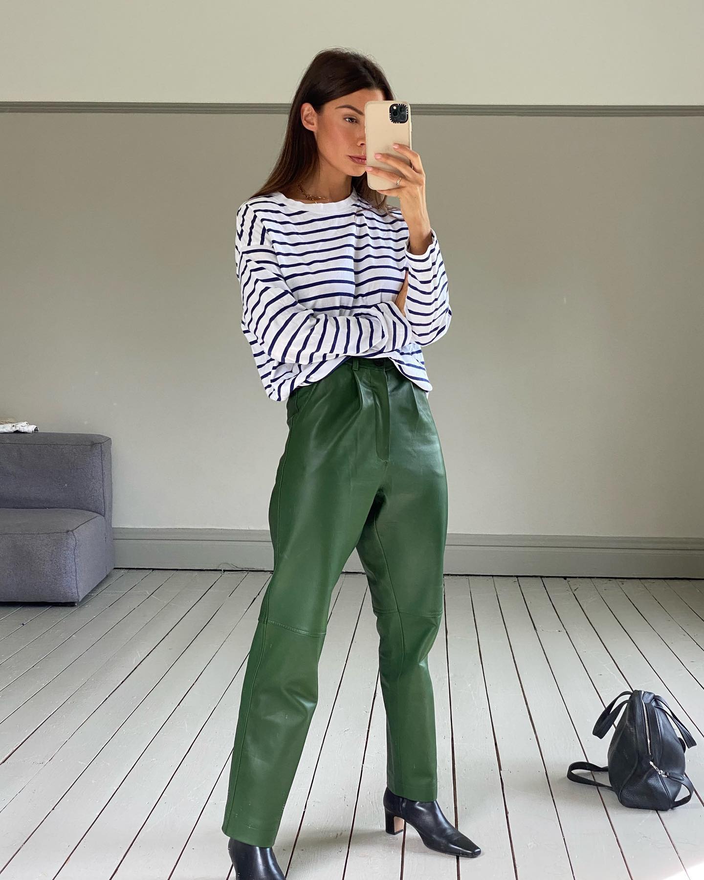 Marianne wearing green leather trousers