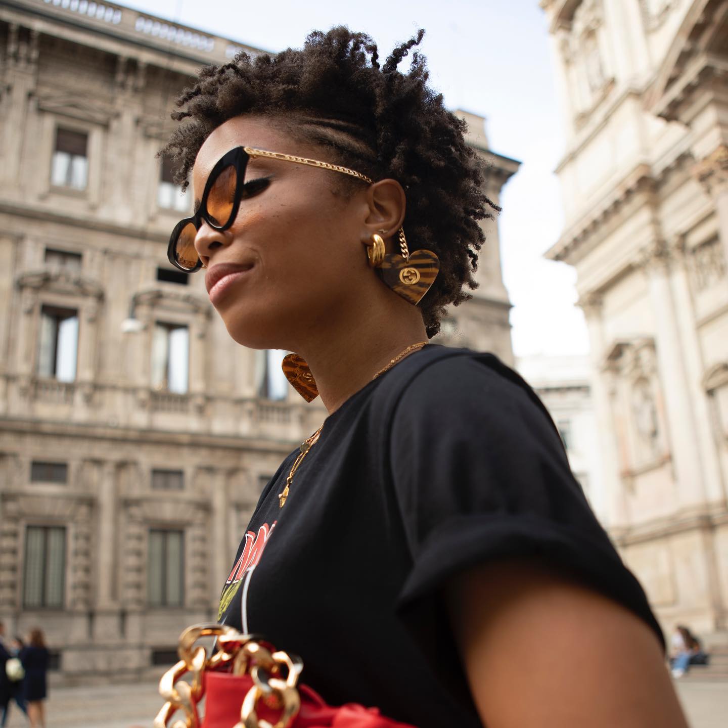 Designer Logo Earrings: @slipintostyle wears a pair of Gucci logo earrings