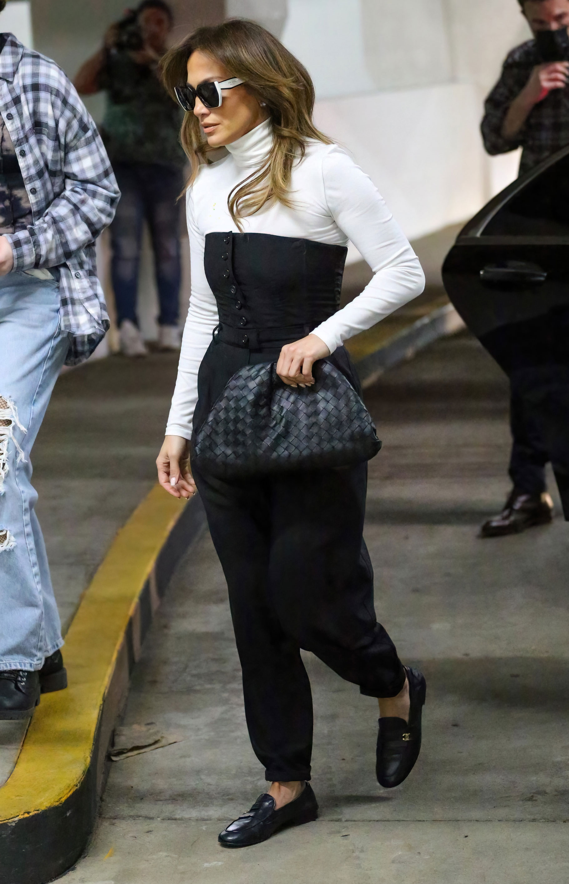 Jennifer Lopez wearing flat black loafers