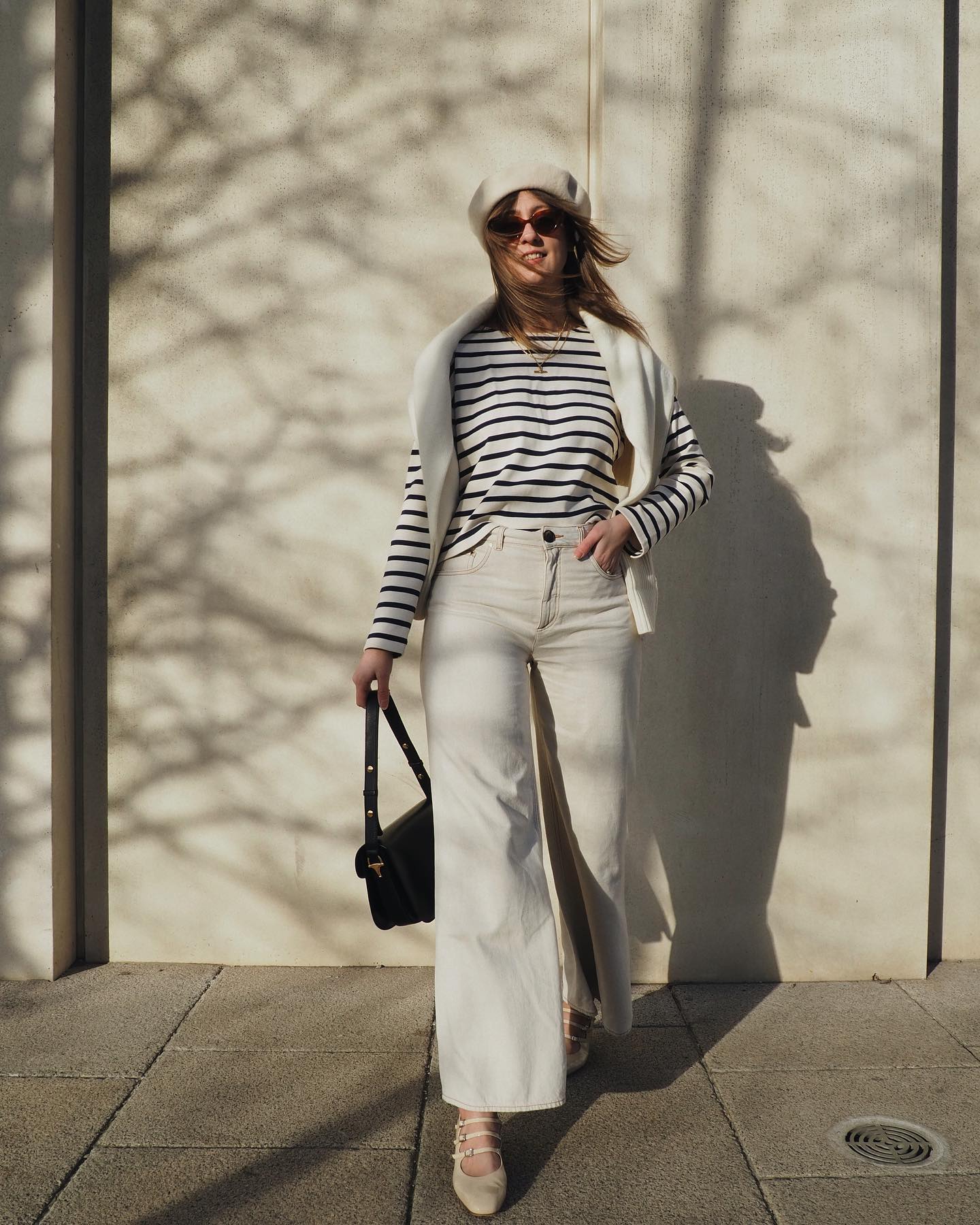 Rachael wearing Breton top with beret and white jeans