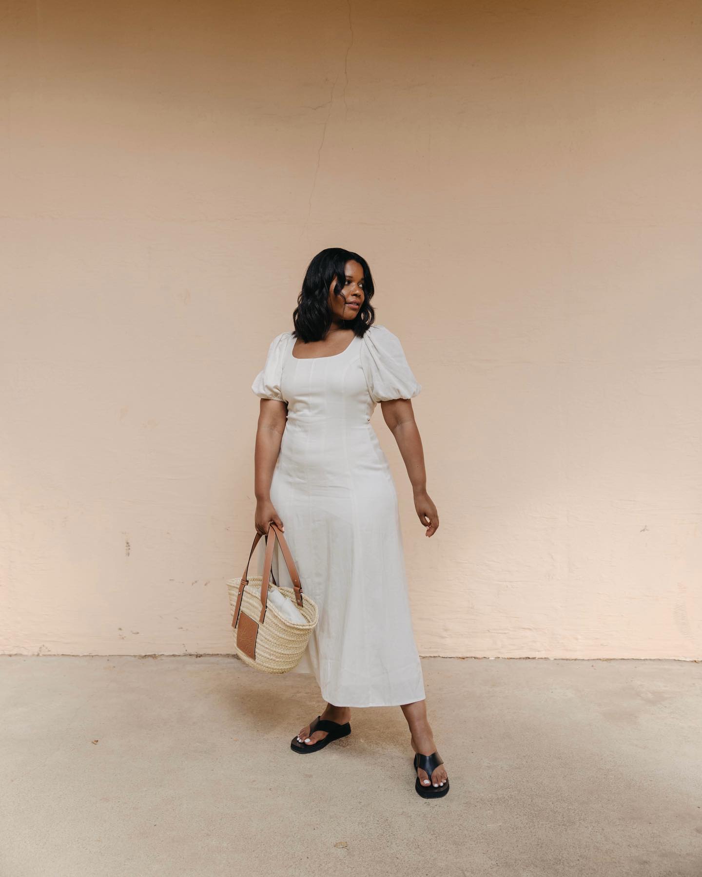Karina wearing white midi dress from & Other Stories