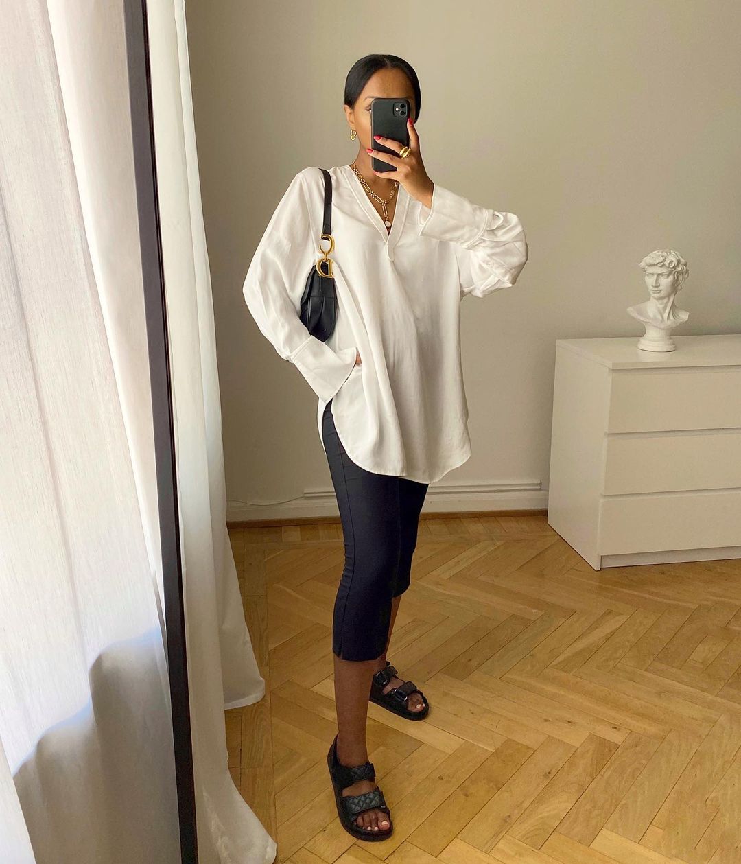 Leggings and Sandal Outfits: @femmeblk wears a loose-fitting blouse with leggings