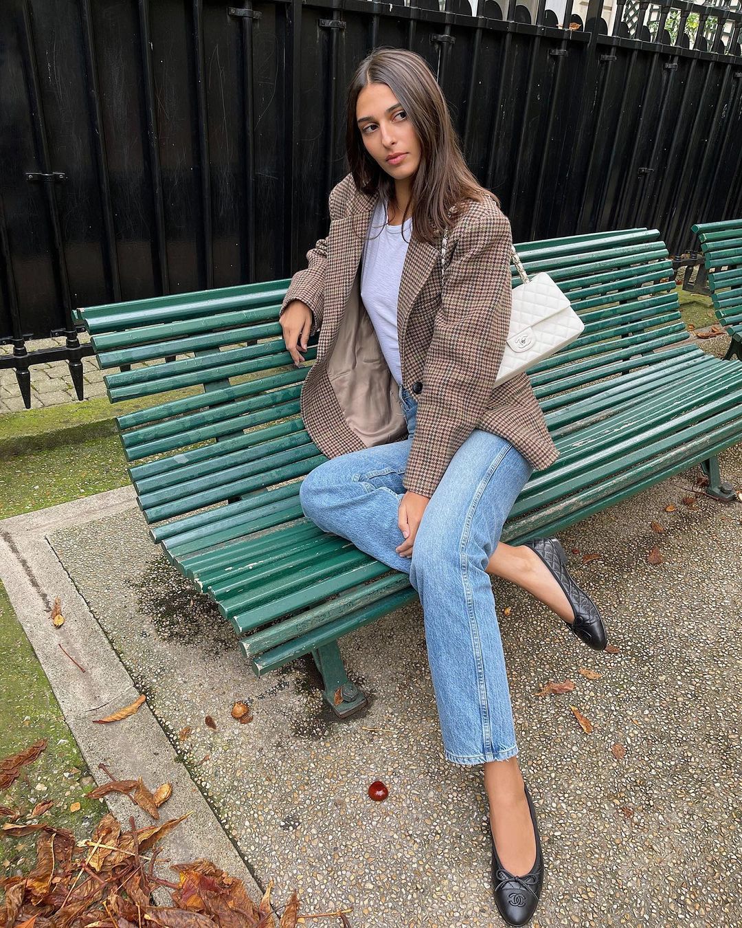 French girl autumn shoes: @salome.mory styles ballet flats with blue jeans and a check-print blazer