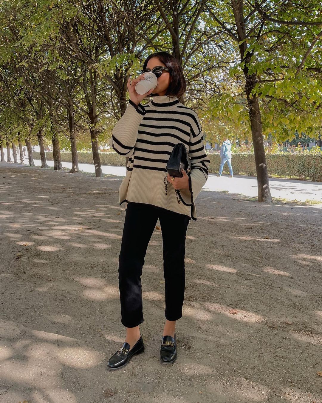 @cocobeautea wears a Breton stripe jumper and black trousers for a chic autumn outfit