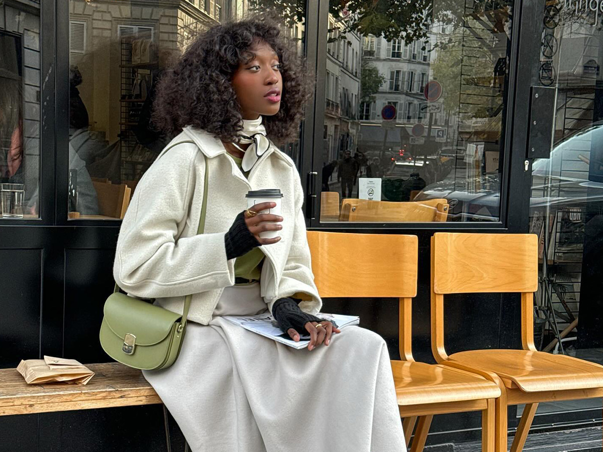 woman wearing a white jacket and A-line skirt in Paris