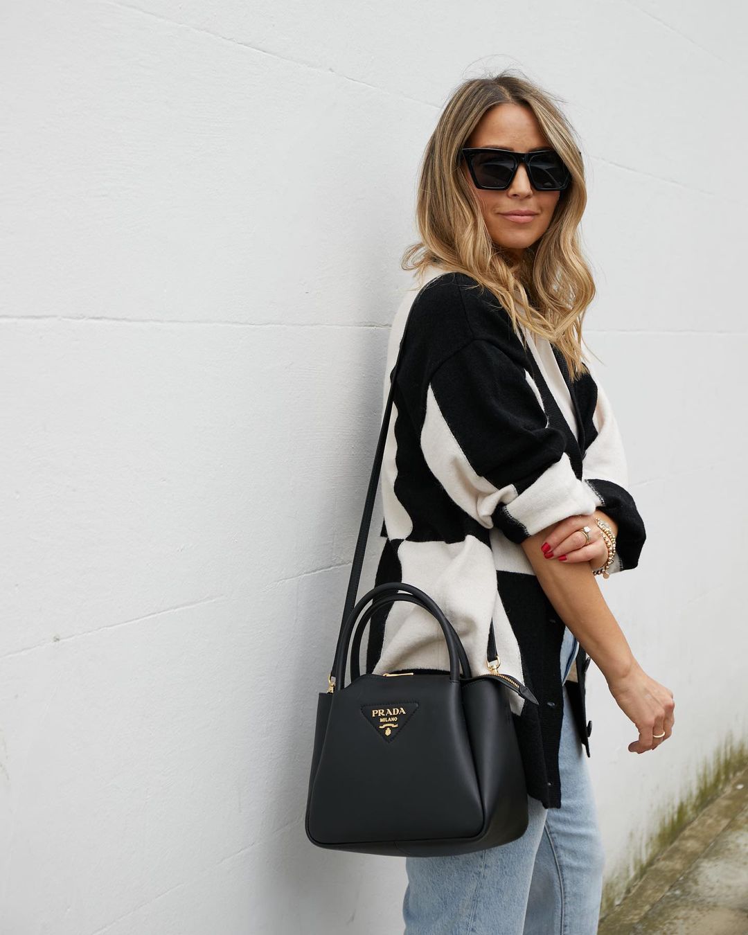 Rachel Stevens wears a monochrome cardigan from & Other Stories with classic jeans