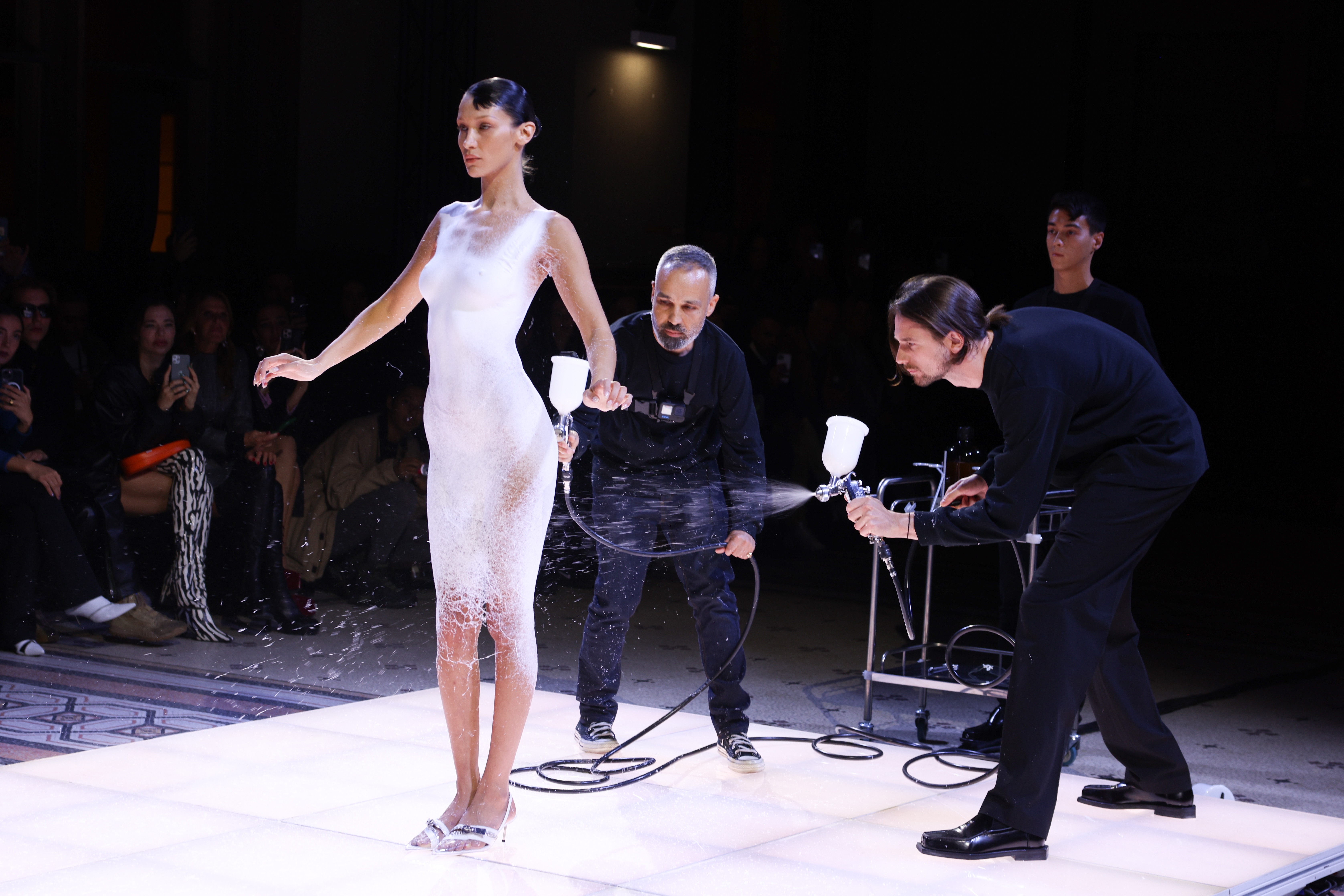 Spring/Summer 2023 Fashion Trends: Bella Hadid closes the Coperni spring/summer 2023 fashion show, having a dress sprayed on to her body